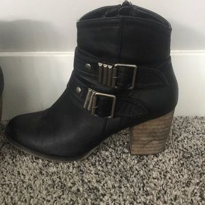 Black buckled boots